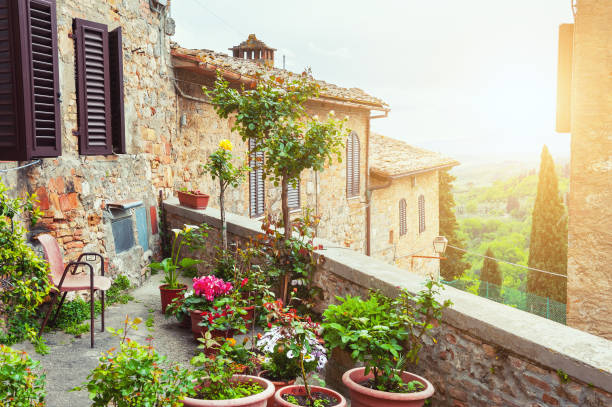 beautiful terrace with flowers. - san gimignano imagens e fotografias de stock