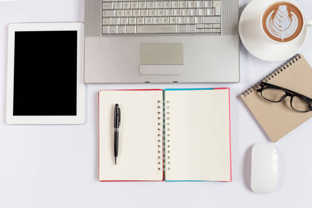 istock Office desk table with laptop,smartphone and coffee cup notepad and accessories. Top view 1306478484