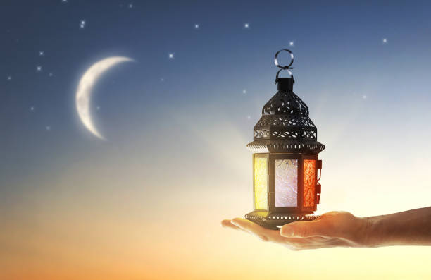 istock Ornamental Arabic lantern with burning candle 1306480692