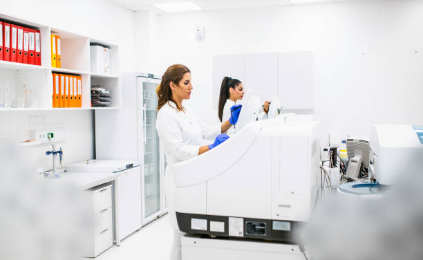 istock Scientists working with automated analyser in the laboratory 1306481771
