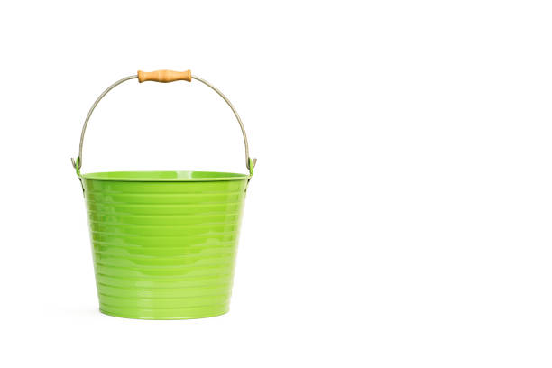 A green metal bucket with handle on a white background