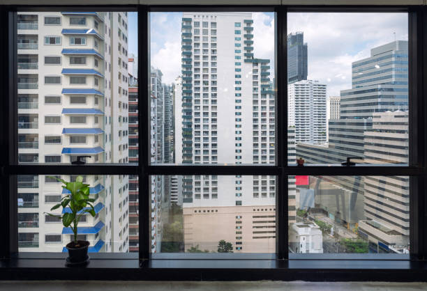 istock Interior of window office and crowded building in downtown 1306487247