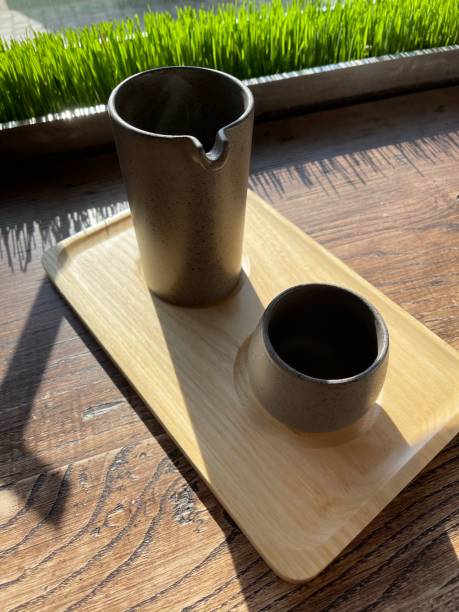 istock teapot with tea and a cup on the windowsill 1306490416