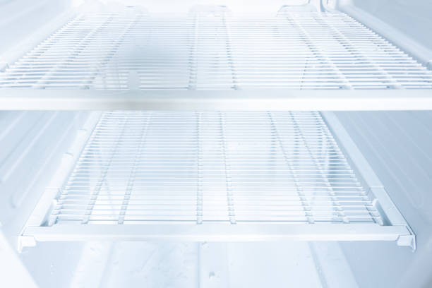 domestic fridge freezer defrost problem concept. refrigerator covered with ice. appliance repair concept - defreeze imagens e fotografias de stock