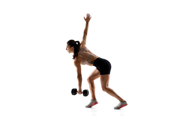istock Caucasian professional female athlete training isolated on white studio background. Muscular, sportive woman. 1306492402
