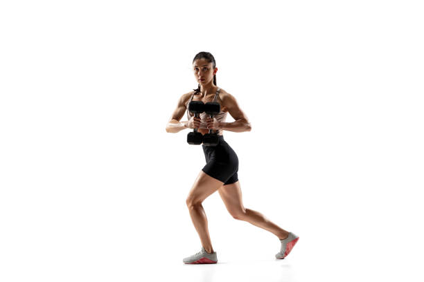 istock Caucasian professional female athlete training isolated on white studio background. Muscular, sportive woman. 1306492403