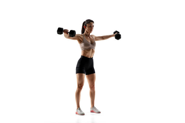 istock Caucasian professional female athlete training isolated on white studio background. Muscular, sportive woman. 1306492404