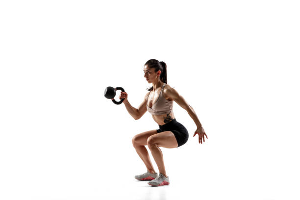 istock Caucasian professional female athlete training isolated on white studio background. Muscular, sportive woman. 1306492407
