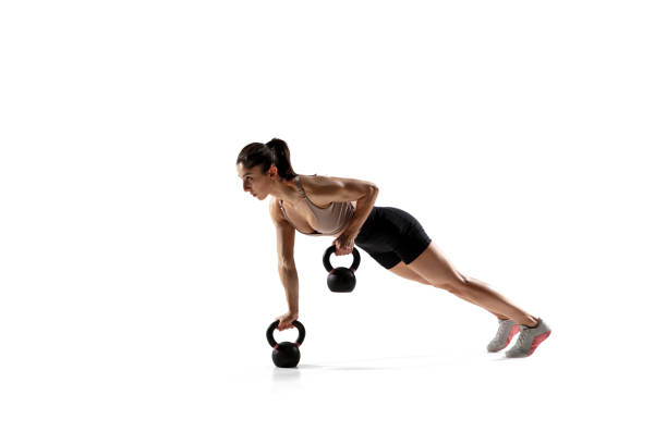 istock Caucasian professional female athlete training isolated on white studio background. Muscular, sportive woman. 1306492412