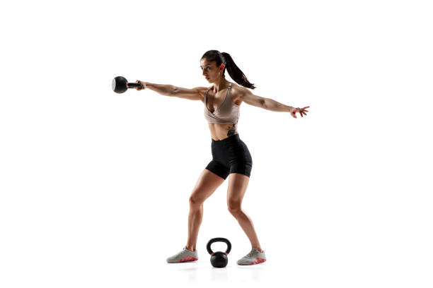 istock Caucasian professional female athlete training isolated on white studio background. Muscular, sportive woman. 1306492427