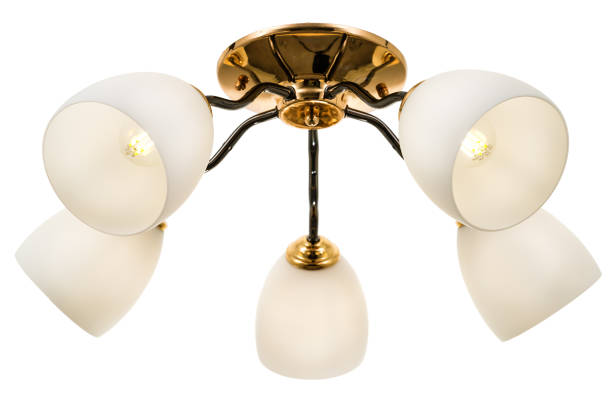 istock Black five-lamp chandelier with a gold base and matte white shades 1306493183
