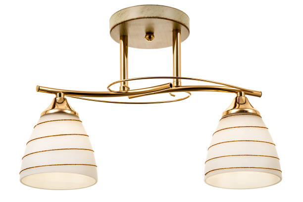 istock Two-lamp gold-tone ceiling lamp with a white base, bronze patched and matt white shades with a spiral pattern 1306493185