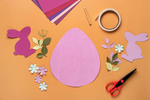 istock Step 8. Step by step instruction: how to make a Easter card out of colored cardboard. Easter card with bunny. 1306493741