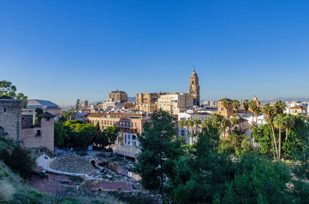 Malaga cityscape. Roman theatre and Cathedral of Malaga in Andalusia, Spain. Panorama of Malaga, Spain. Ancient Roman amphitheatre and Cathedral of Malaga in the background. alcazaba of málaga stock pictures, royalty-free photos & images