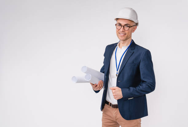 istock Successful mature caucasian engineer with architectural plan isolated over white background 1306498278