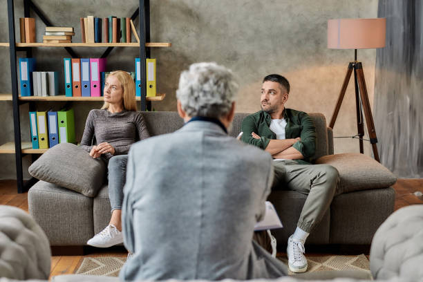 istock Depressed young spouses during session with professional psychotherapist 1306498399