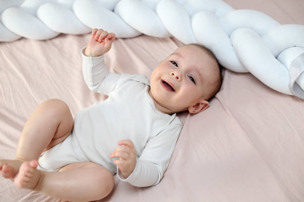 istock Baby lying on the bed 1306499425