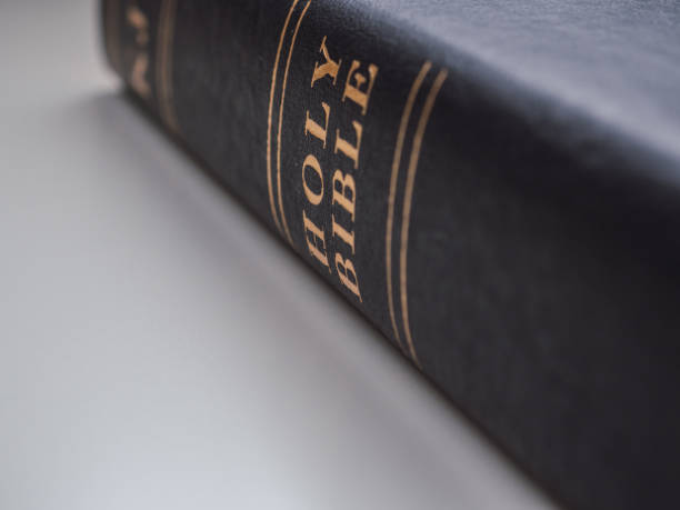 istock Black holy bible with white background and copy space 1306500234