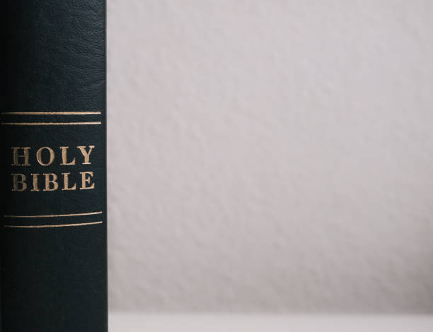 istock Black holy bible with white background and copy space 1306500344