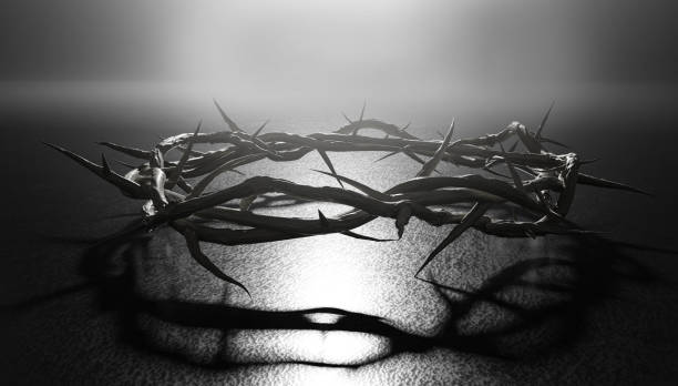 istock Crown of Thorns Symbol of Crucifixion Dark Backlight 3D Rendering 1306500505