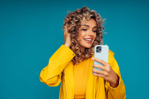 istock Beautiful smiling woman taking selfie 1306500681