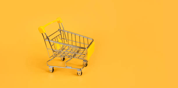 istock shopping trolley on a bright yellow background 1306501023