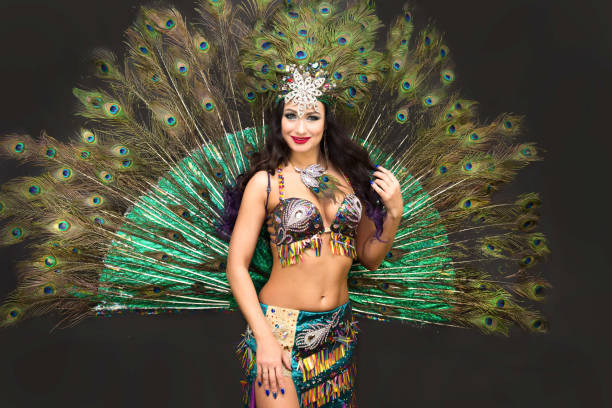 Woman Asian dancer in peacock feather costume