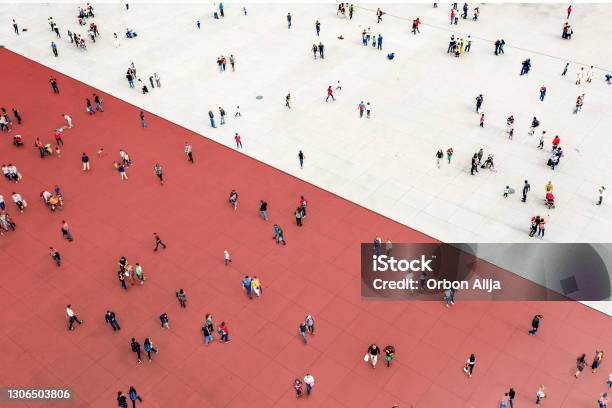 Crowds Standing On Two Separated Zones Stock Photo - Download Image Now - People, Separation, Crowd of People