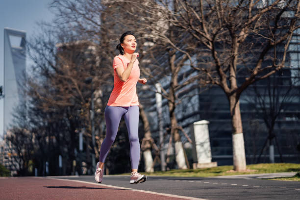 istock Female running in the city 1306507314