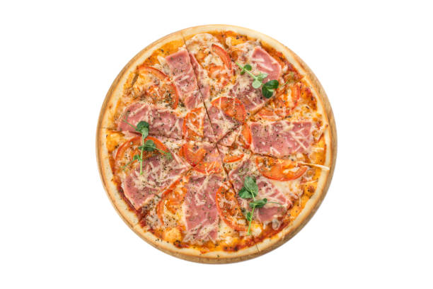 istock Pizza with ham, cheese, tomatoes on wooden board isolated on white background 1306507518