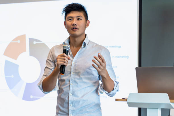 istock Young businessman giving presentation in board room 1306509056