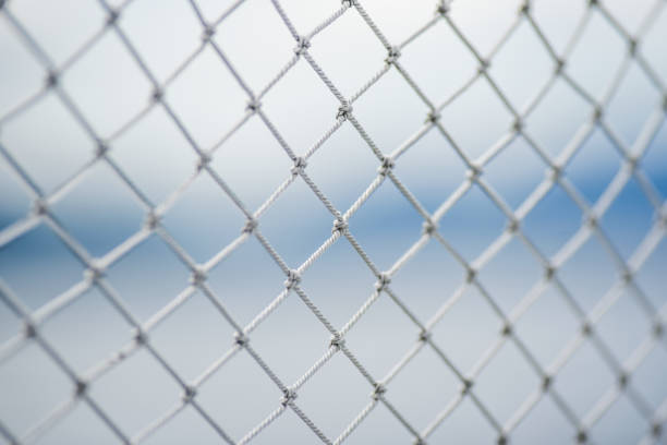 A material net that is a decoration on a yacht, performing protective functions. Texture or background.