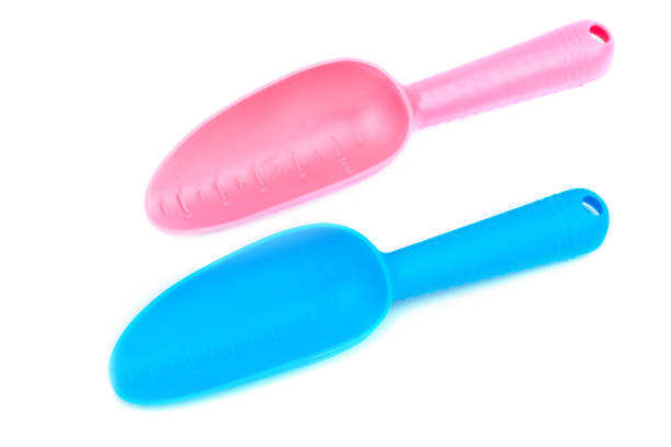 istock Pink and blue plastic shovels 1306509992