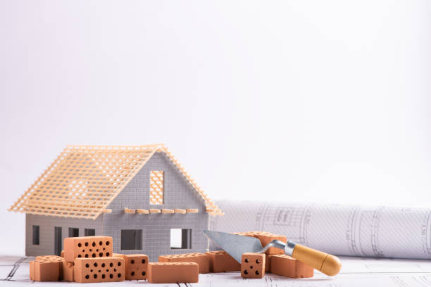 istock House in construction - project with brick and blueprint 1306510256