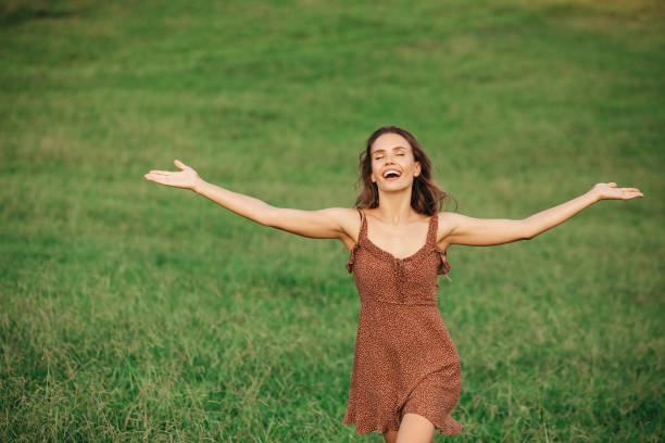 istock Beautiful woman running on the field 1306510382