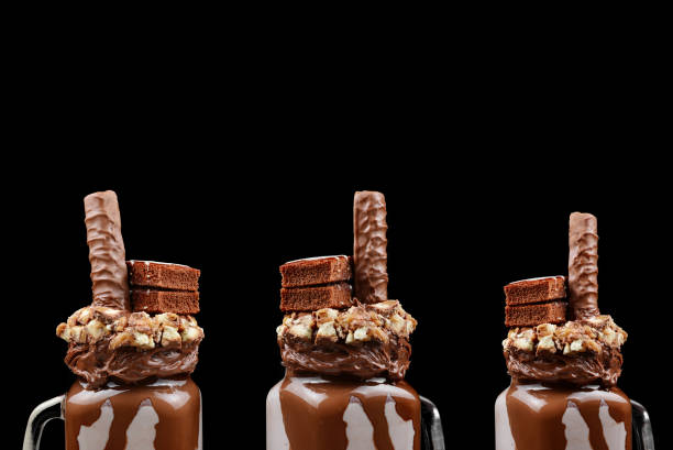 istock Chocolate extreme milkshake with brownie cake, chocolate paste and sweets. Crazy freakshake food trend. Copy space 1306510393