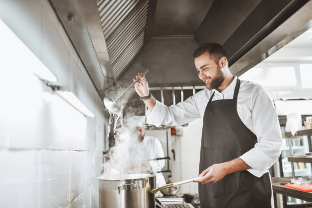istock Delicious Stew Prepared By Expert Chef In Modern Kitchen 1306512136