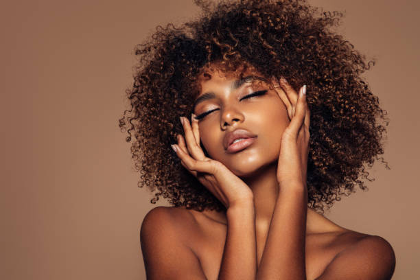 istock Beautiful girl with curly hairstyle 1306514084