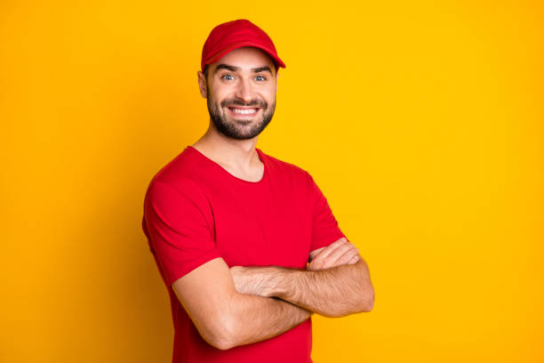 istock Profile side view portrait of attractive cheerful virile guy mailman folded arms fast shipping service isolated over vivid yellow color background 1306516475