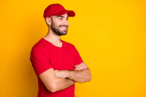 istock Profile side view portrait of attractive cheerful content guy mailman folded arms copy space isolated over vivid yellow color background 1306516558