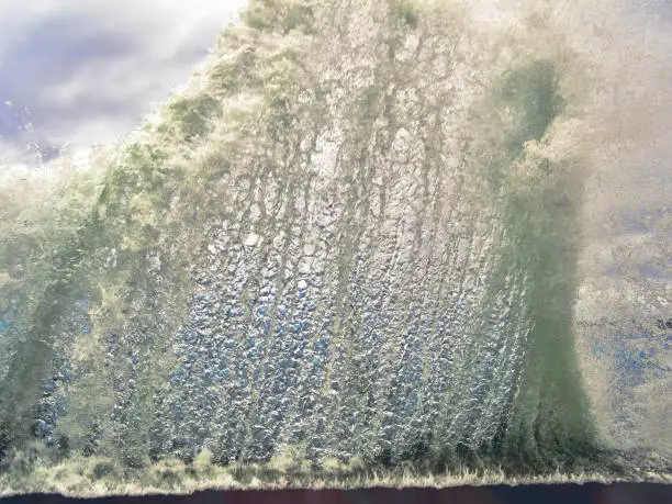 Photo of Wave crushing (braking) of sea or ocean beach coast. Water splash wave storm hurricane crash of boardwalk. Waves and foam from water crash in storm weather.