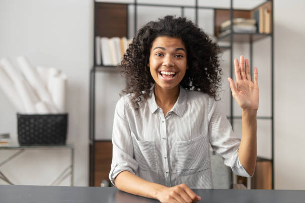 istock African-American woman saying hey on an interview 1306518109