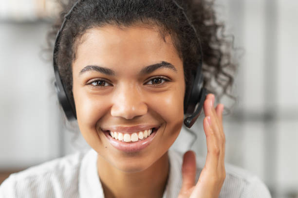 istock African American woman wearing a headset 1306518133
