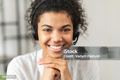 istock African American young lady wearing a headset 1306518173