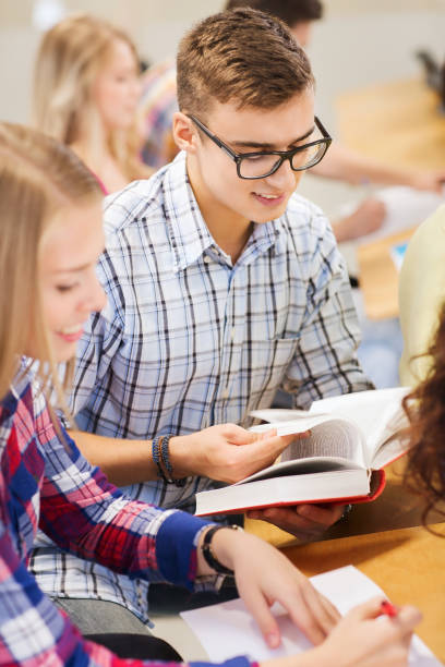 istock group of smiling students with books 1306518503