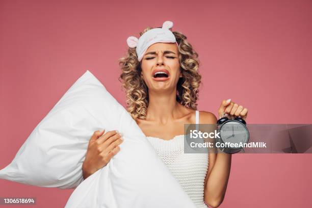 Portrait Of A Fresh And Lovely Woman With Pillow Alarm Clock Stock Photo - Download Image Now