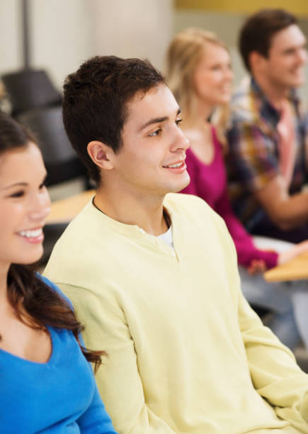 istock group of smiling students in lecture hall 1306518989