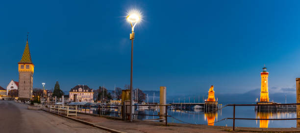 istock Harbor entrance of Lindau Bodensee at night 1306519092