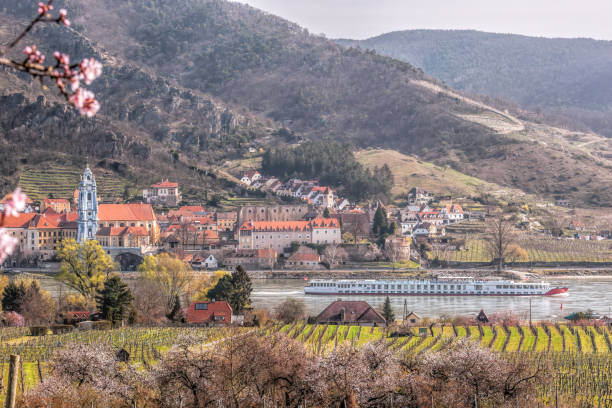 istock Durnstein village during spring time with tourist ship on Danube river in Wachau, Austria 1306519632