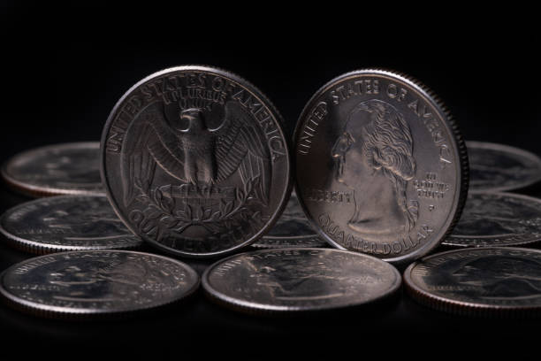 istock Several American bargaining coins in denominations of 25 cents 1306520278